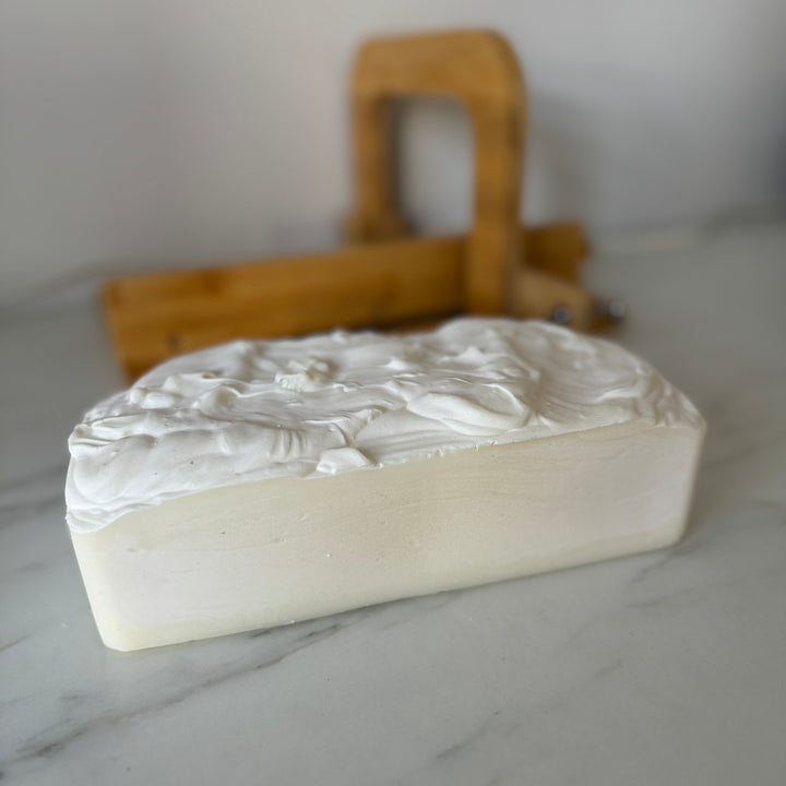 Bar of soap with a textured surface on a marble surface